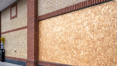 commercial property boarded up windows preventing further damage